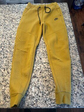 NIKE MENS TECH PANTS SMALL SLIM FIT TAPER LEG REGULAR LENGTH GOLD